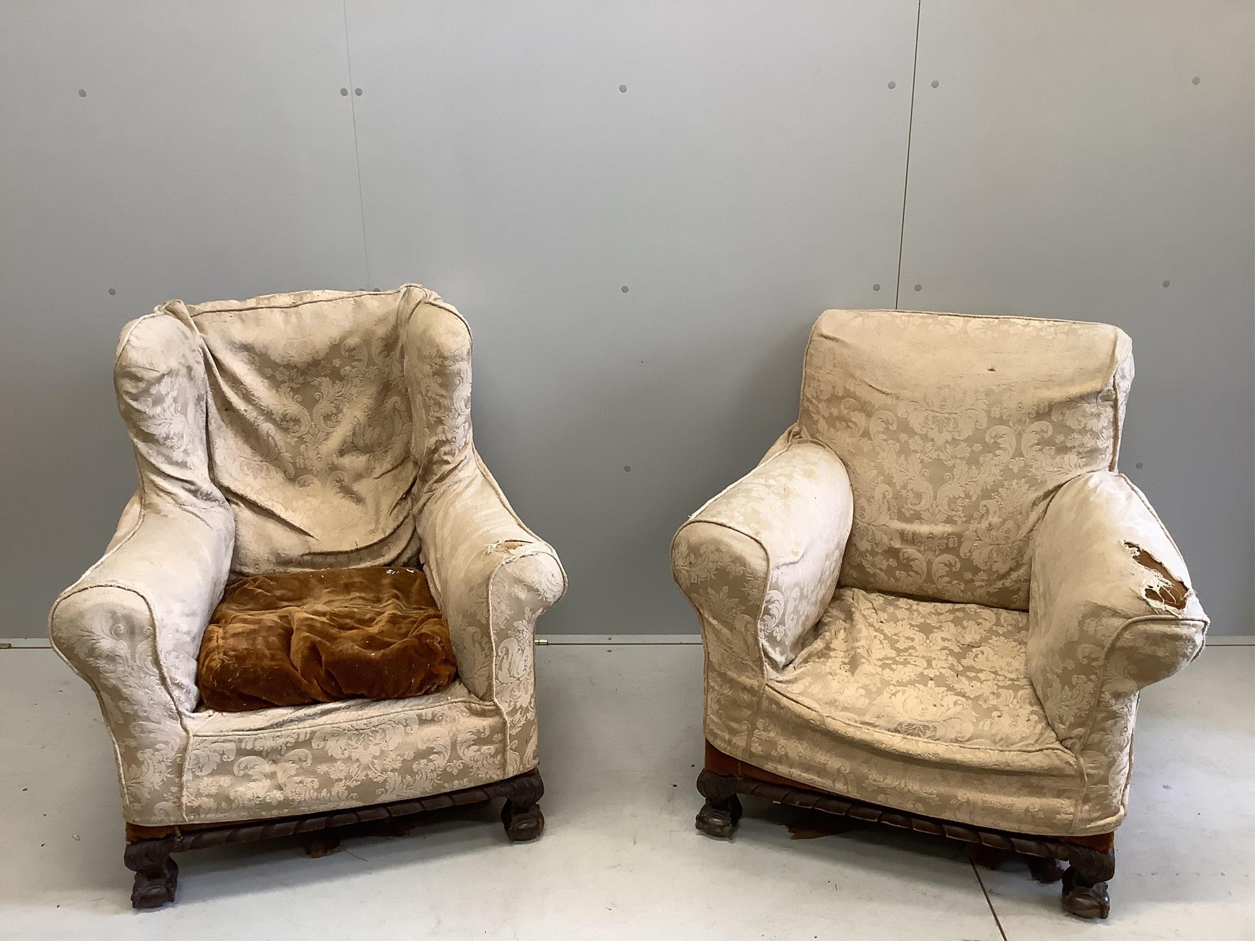 A near pair of early 20th century upholstered armchairs, larger width 81cm, depth 78cm, height 88cm. Condition - poor